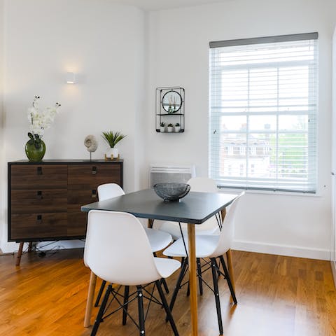 Share a meal or work remotely at the dining table in the window