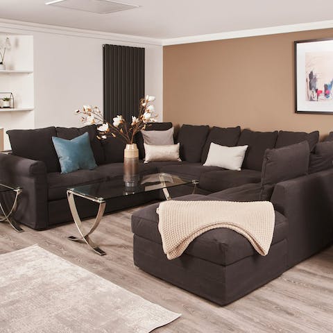 Snuggle up under the blanket on the huge wrap-around sofa