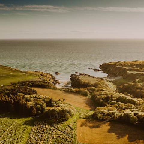 Stroll down to the long beaches and tidal rushes of Dunskey Glen, thirty minutes away