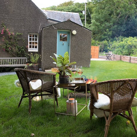 Sip a glass of your favourite tipple in the garden while enjoying woodland views 