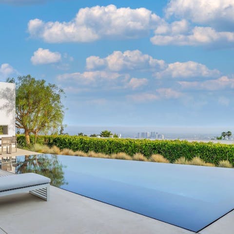 Gaze out over the City of Angels while sipping on cocktails by the pool