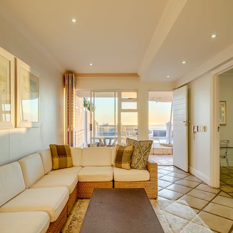 Snuggle up on the sofas after a sunny day along the coast