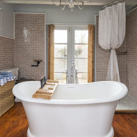 Enjoy an indulgent soak in the freestanding tub