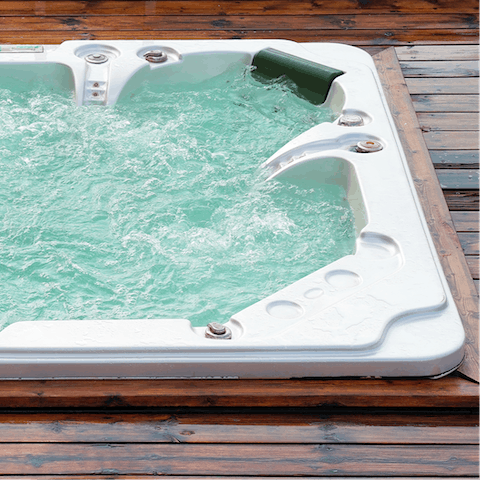 Take a long, luxurious soak in the outdoor hot tub