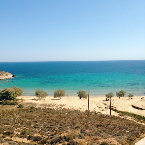 Take a seven-minute drive down to Agios Georgios Beach for a day on the sand