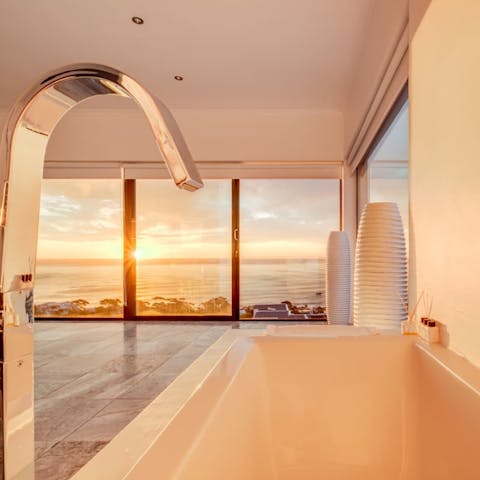 Unwind in your sleek bathtub, accompanied by ocean views