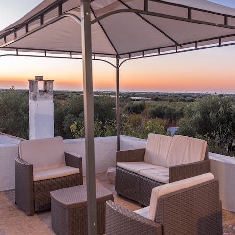 Watch the sun go down and the sky turn pink from the lounge area on the roof terrace