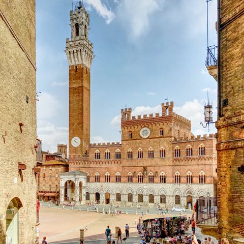 Drive into the city of Siena and its well-preserved historic centre