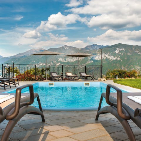 Catch a tan by the private pool with views of the Grigne Mountain range