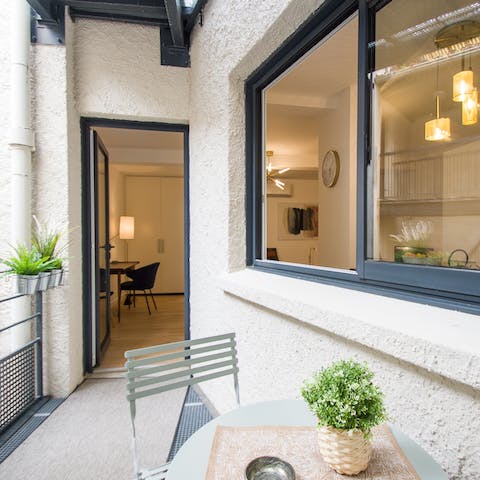 Enjoy the magic of city living with drinks on the balcony