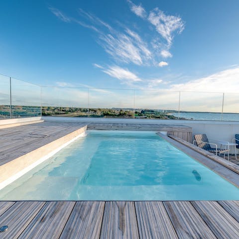 Stare out to sea as you swim gentle laps in the pool