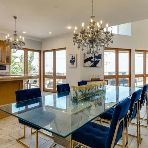 Dine on delicious home-cooked meals beneath the dazzling chandelier in the open-plan living area