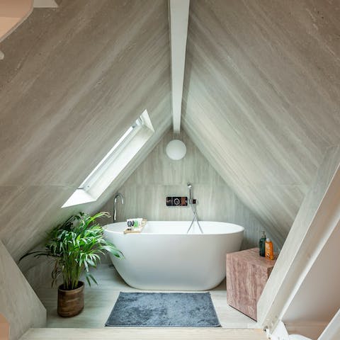 Sink into the freestanding tub after a day of sightseeing