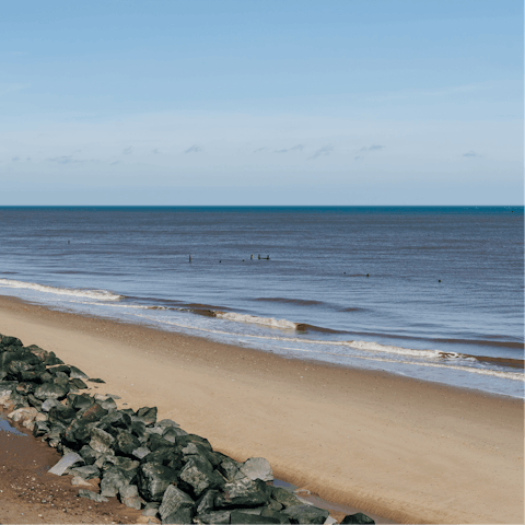 Enjoy a stroll along Mundesley Beach, a ten-minute car ride away