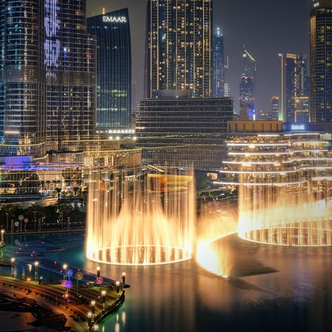 Take in the awe-inspiring light show at The Dubai Fountain, a short walk away