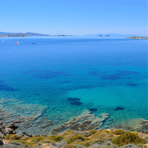 Walk eleven minutes to Piperi Beach to swim in the crystal clear water