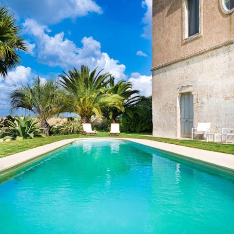 Dive into the silky waters of the private swimming pool