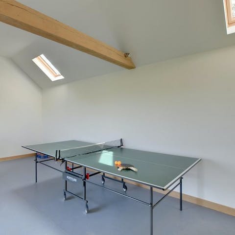 Battle it out over a game of  ping pong in the games room