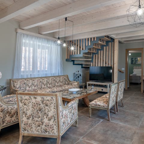 Snuggle up for a cosy evening of movies and wine in the comfy living room