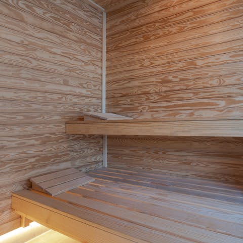 Relax and unwind in the luxurious sauna room