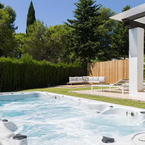 Unwind in the swim spa in the pretty garden