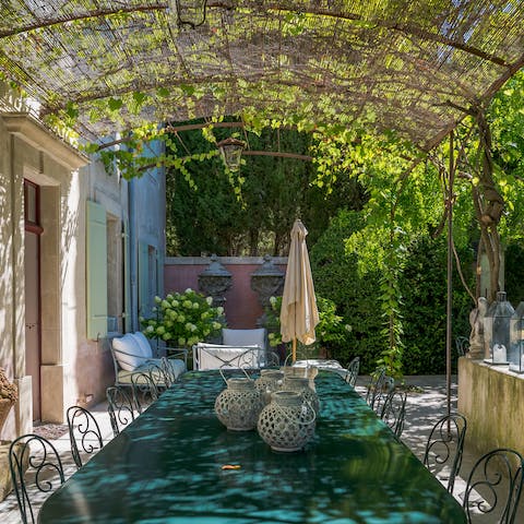 Enjoy a cheese and wine alfresco under the vine-covered arch
