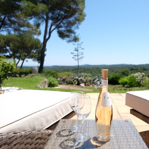 Open a bottle of French wine and relax on the sun loungers