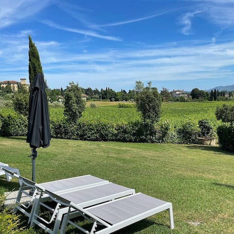 Relax in the private garden space and soak up the sunshine on a lounger