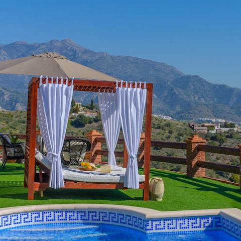 Catch up on your holiday reading while lounging on the Balinese bed