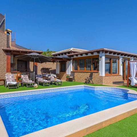 While away sunny hours taking dips in the private pool