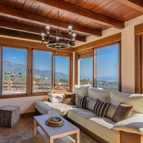 Lounge in the living room while admiring the stunning vistas through the picture windows