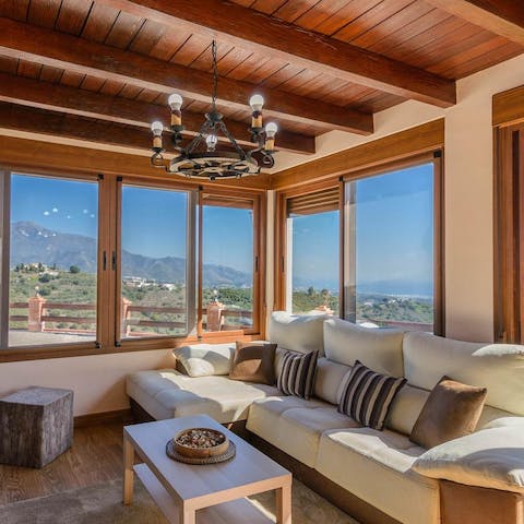 Lounge in the living room while admiring the stunning vistas through the picture windows