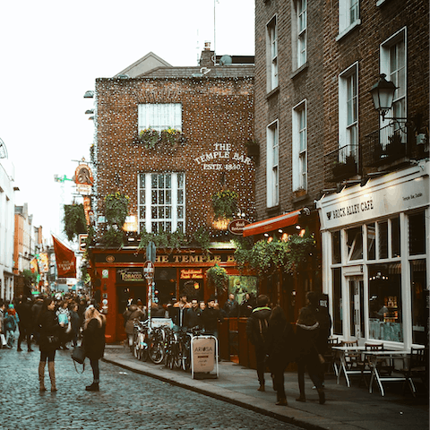 Catch some live music and enjoy the vibrant atmosphere in Temple Bar, a twenty-minute walk away