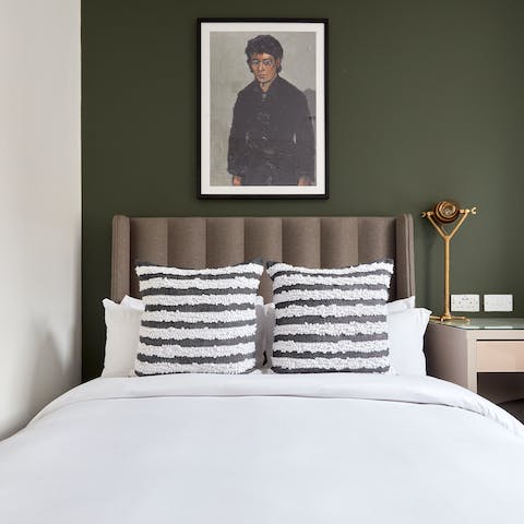 Snuggle up after a long day in the cosy and stylish bedroom 