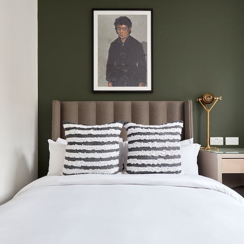 Snuggle up after a long day in the cosy and stylish bedroom