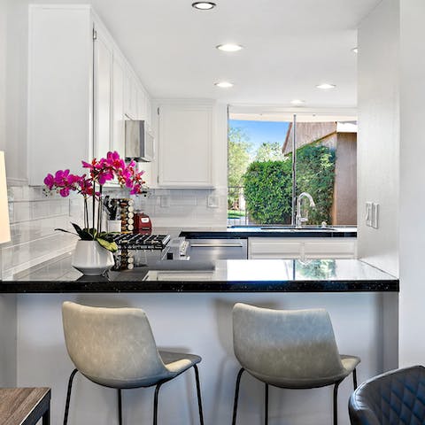 Enjoy morning coffees at the sleek breakfast bar