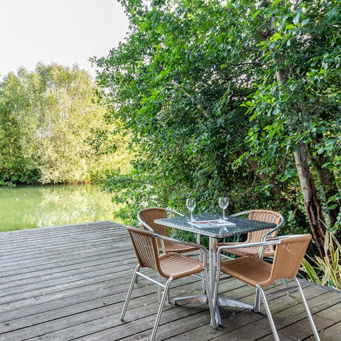 Dine alfresco on the deck with views over Carp Lake