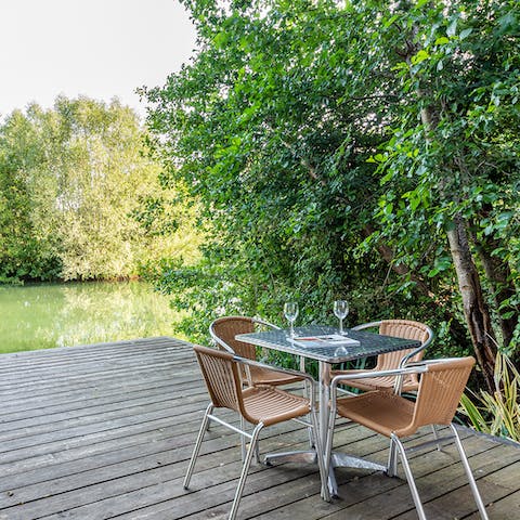 Dine alfresco on the deck with views over Carp Lake