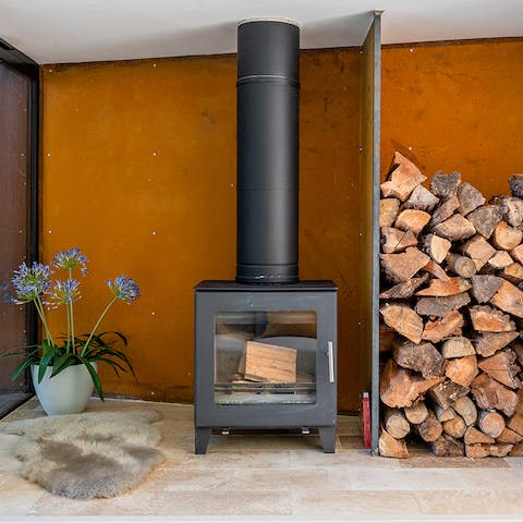 Warm up by the wood-burning stove on cooler evenings