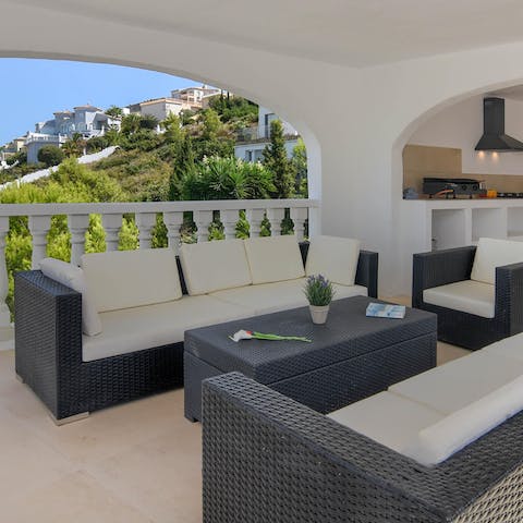 Sip happy hour cocktails at every hour from one of the terrace seating areas