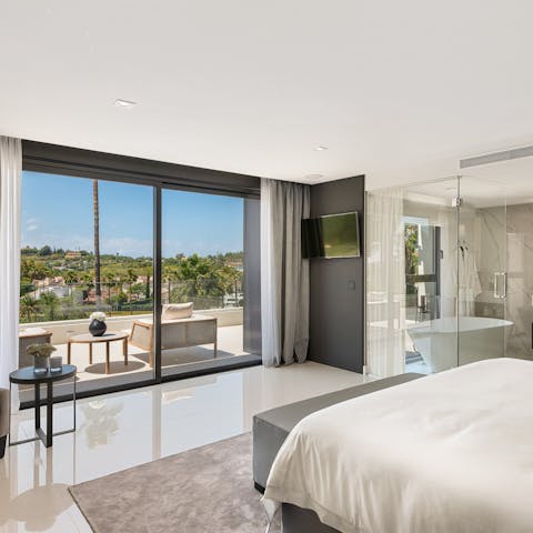 Wake up to breathtaking views from the main en-suite bedroom