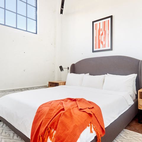 Sleep soundly in the industrial-chic surroundings of the comfortable bedroom