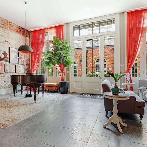 Enjoy sitting in the apartment building’s lobby - you can even play the grand piano