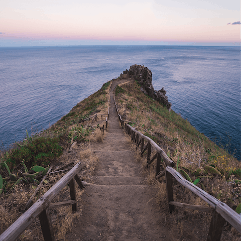 Discover the coastal town of Canico, home to botanical gardens, towering statues and beautiful beaches