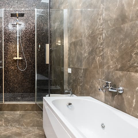 Choose between starting the day underneath the rainfall shower or in the whirlpool tub