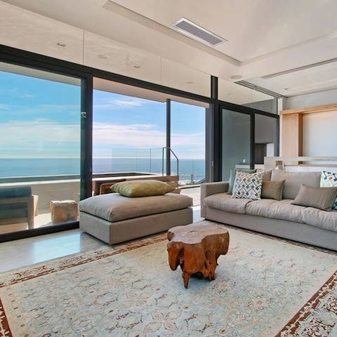 Enjoy plenty of sunshine and sea views thanks to the wall of glass in the living room