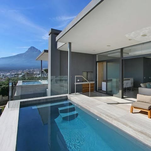 Plunge into the private pool and take in the mountain view