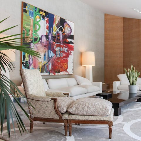 Lounge amongst art and glamorous vintage-style furniture