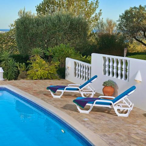 Soak up the Portuguese sunshine from the poolside loungers
