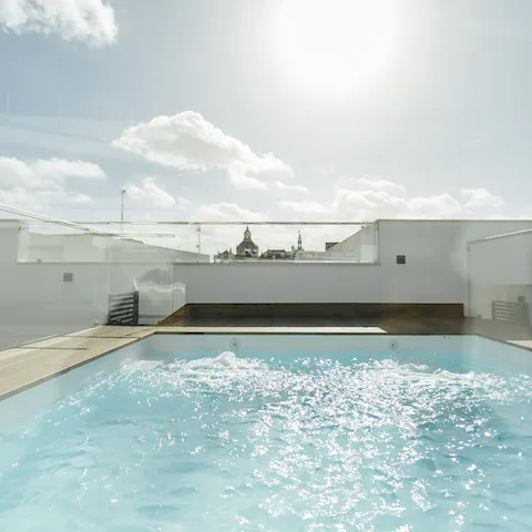 Relax in the rooftop swimming pool under the Spanish sun 